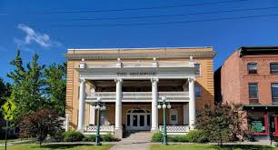 Full building shot in summer including adjacent brick wing