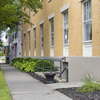 Side of building showing wheelchair-accessible ramp entrance