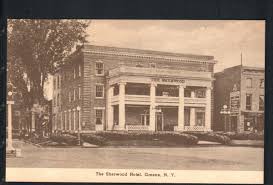 Vintage sepia postcard of The Sherwood Hotel, Greene, N.Y. showing the facade from the street in the early 20th century